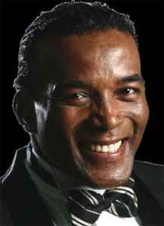 Picture of Howard McCrary wearing black coat